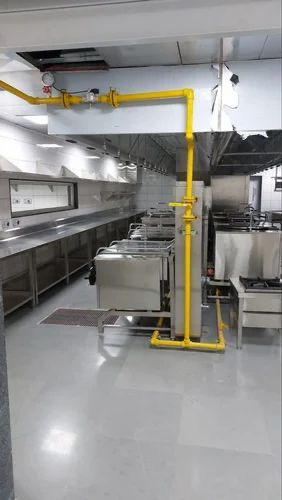 Commercial kitchen gas pipeline installation with yellow pipes and fittings